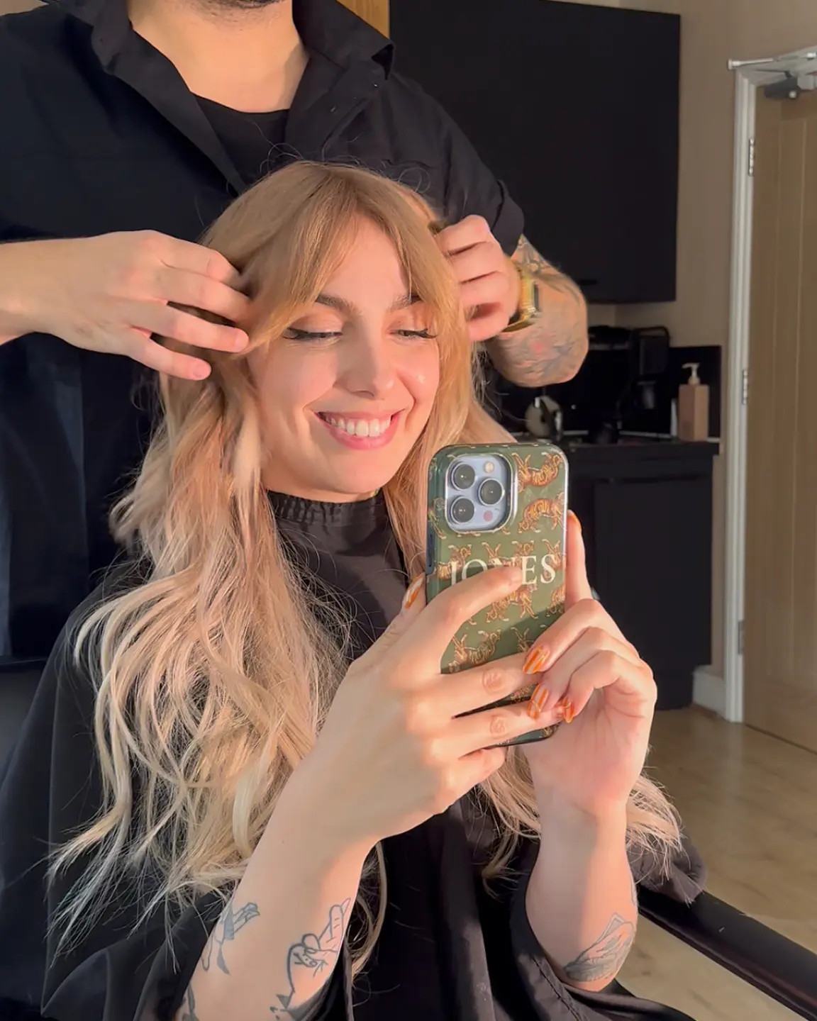 Salon mirror result with blonde extensions